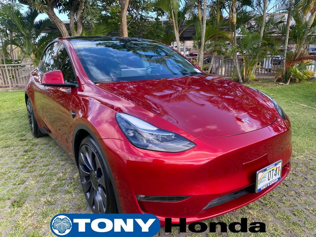 2024 Tesla Model Y Performance in Red — front three-quarter view