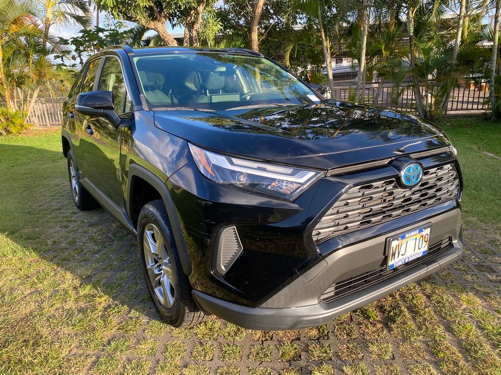 2023 Toyota RAV4 Hybrid LE in Midnight Black Metallic — front three-quarter view