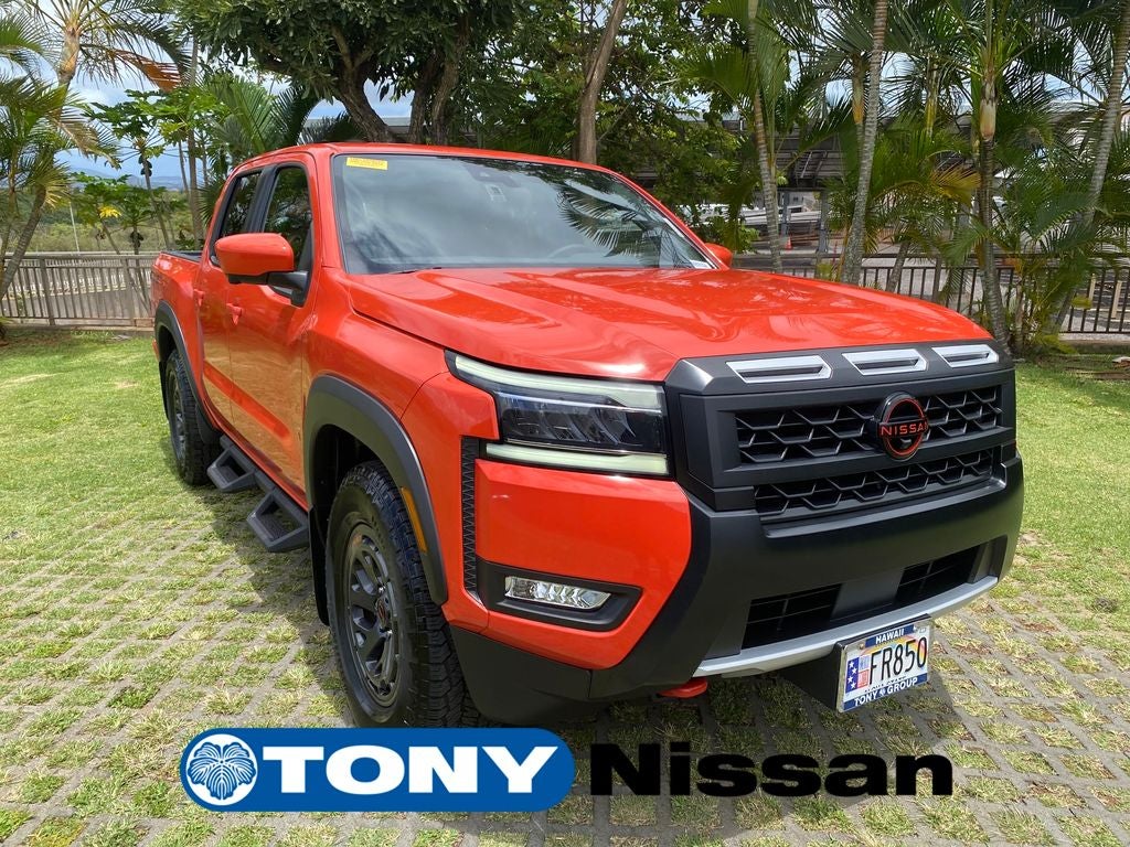 2025 Nissan Frontier PRO-X in Afterburn Orange — front three-quarter view